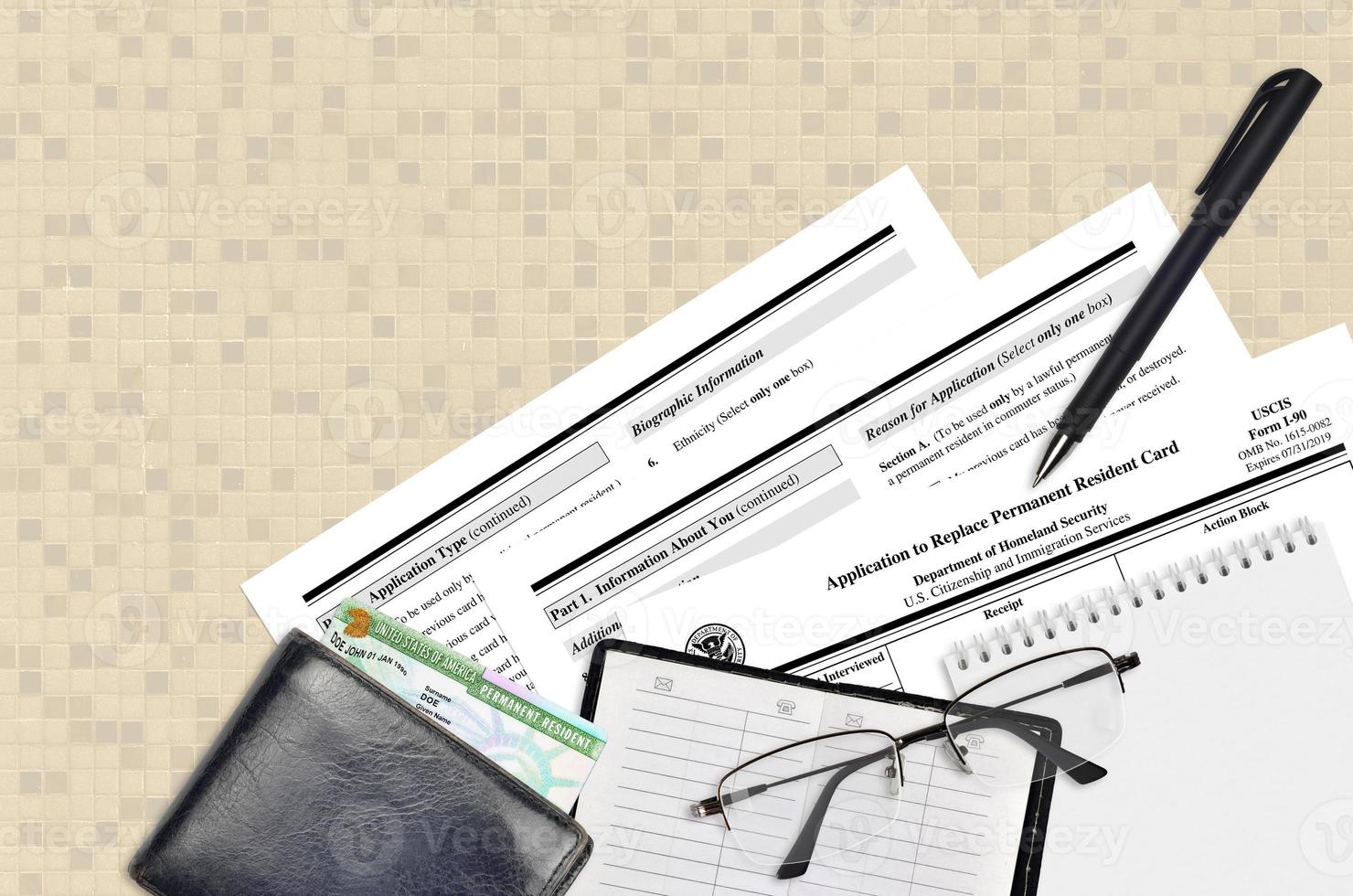 USCIS form I-90 Application to replace permanent resident card lies on flat lay office table and ready to fill. U.S. Citizenship and Immigration services paperwork concept photo