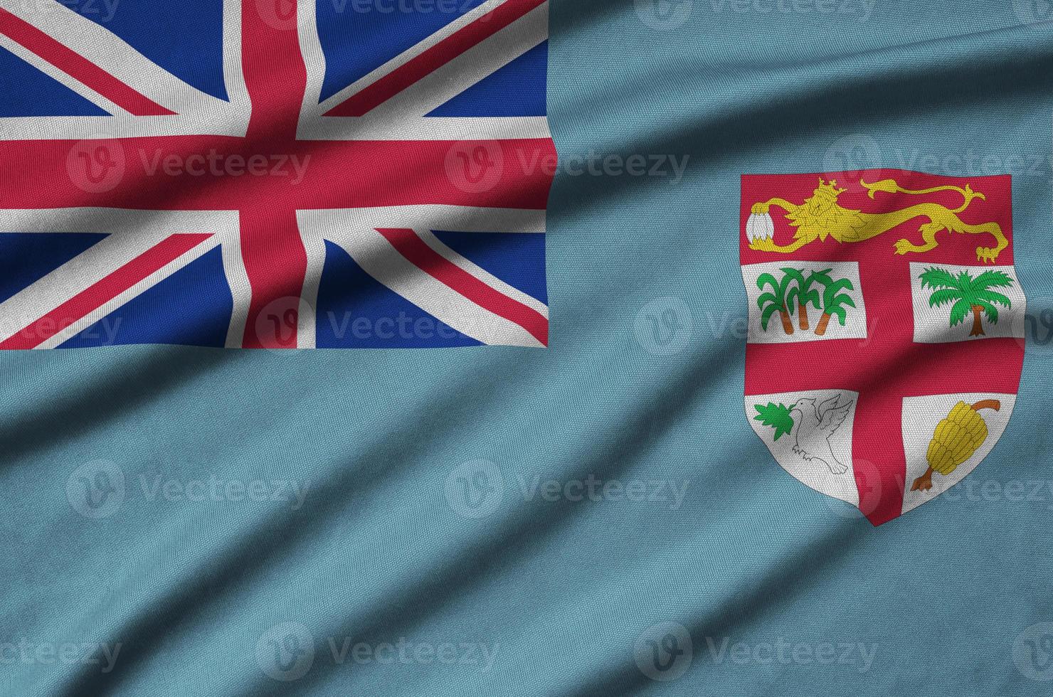 Fiji flag  is depicted on a sports cloth fabric with many folds. Sport team banner photo