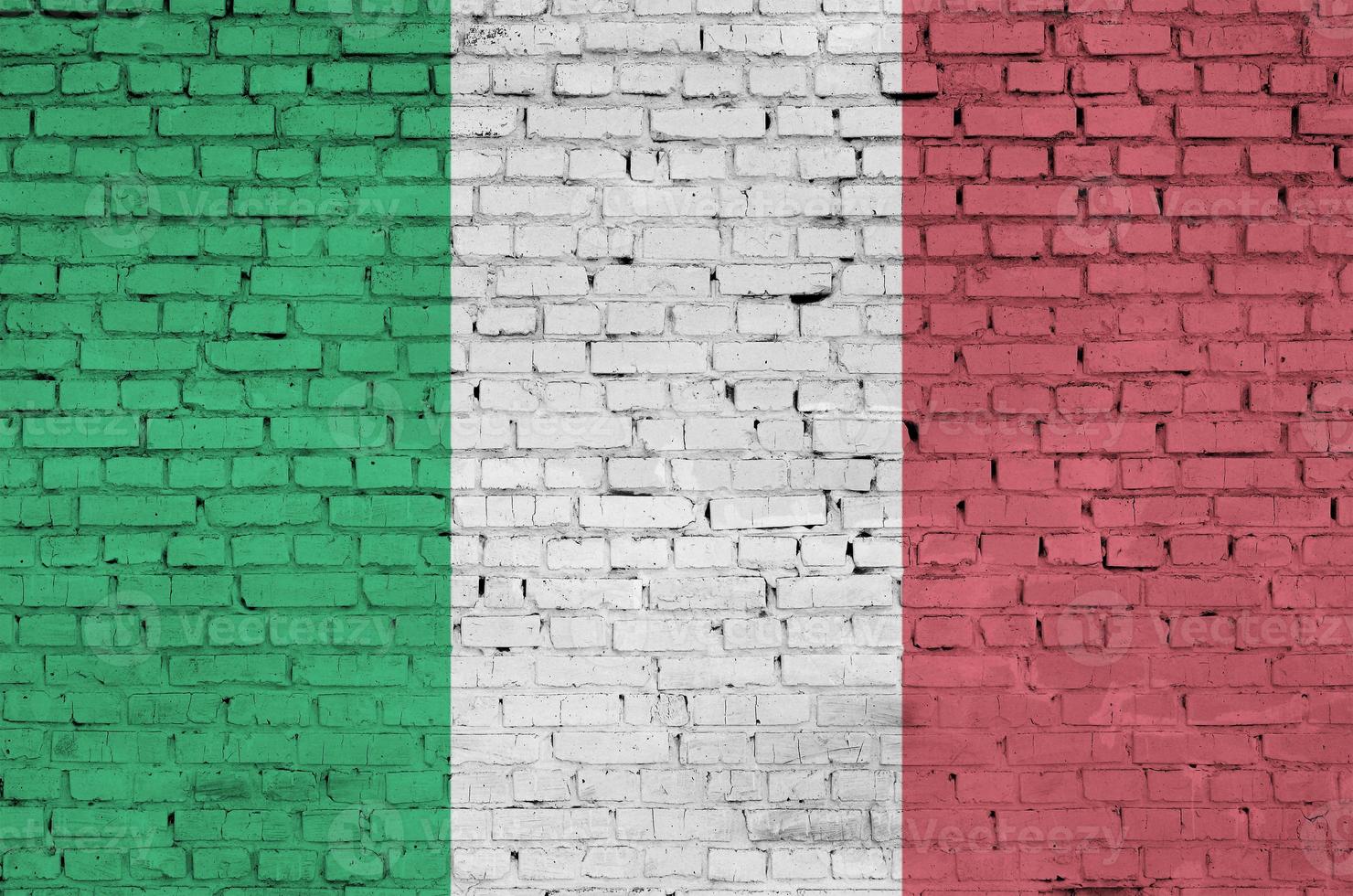 Italy flag is painted onto an old brick wall photo