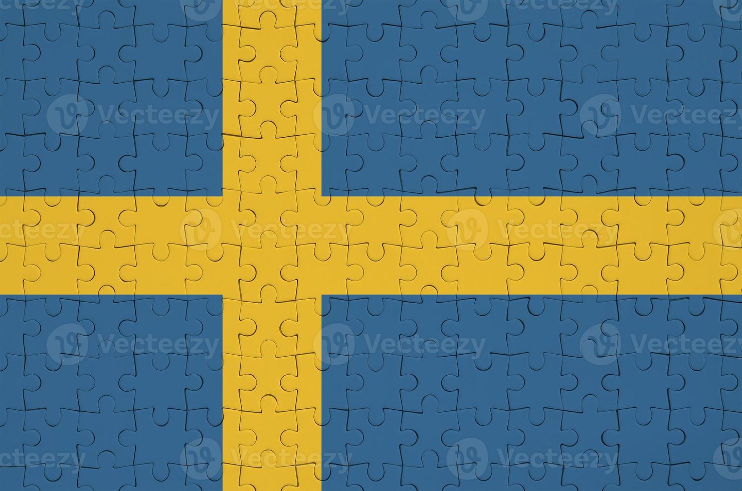 Sweden flag  is depicted on a folded puzzle photo