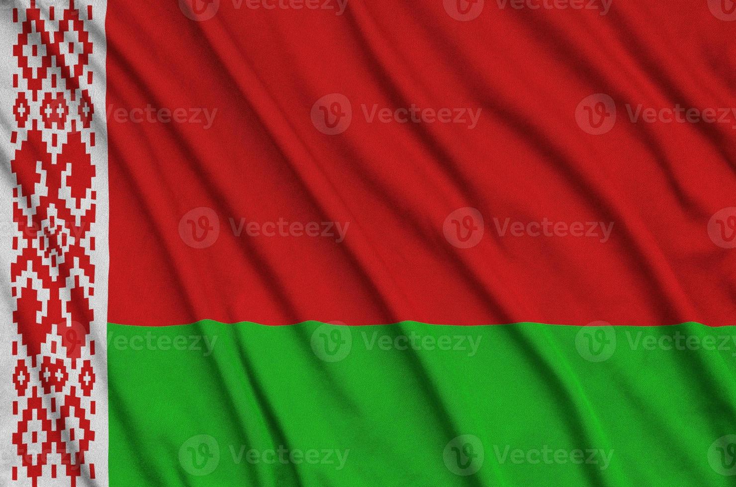 Belarus flag  is depicted on a sports cloth fabric with many folds. Sport team banner photo