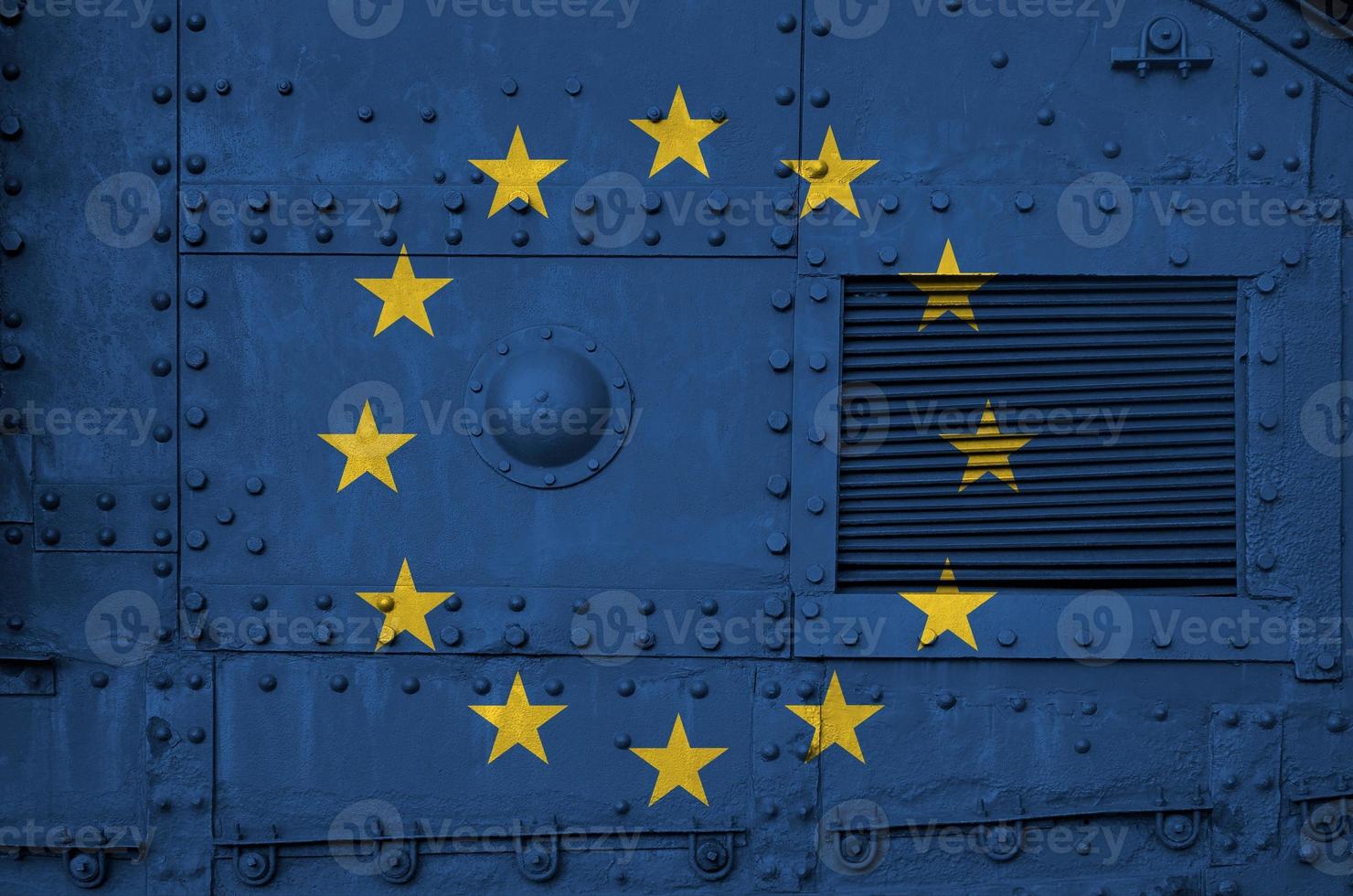 European union flag depicted on side part of military armored tank closeup. Army forces conceptual background photo