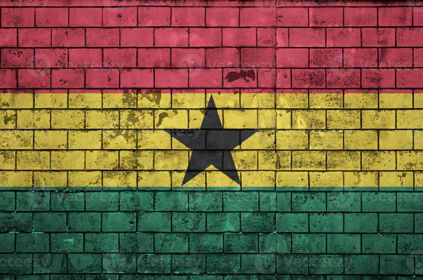 Ghana flag is painted onto an old brick wall photo