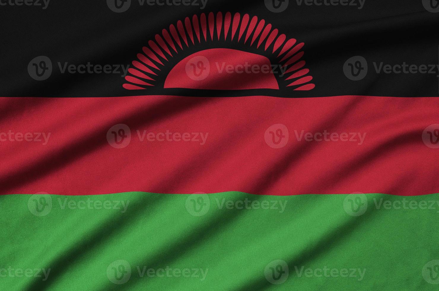 Malawi flag  is depicted on a sports cloth fabric with many folds. Sport team banner photo