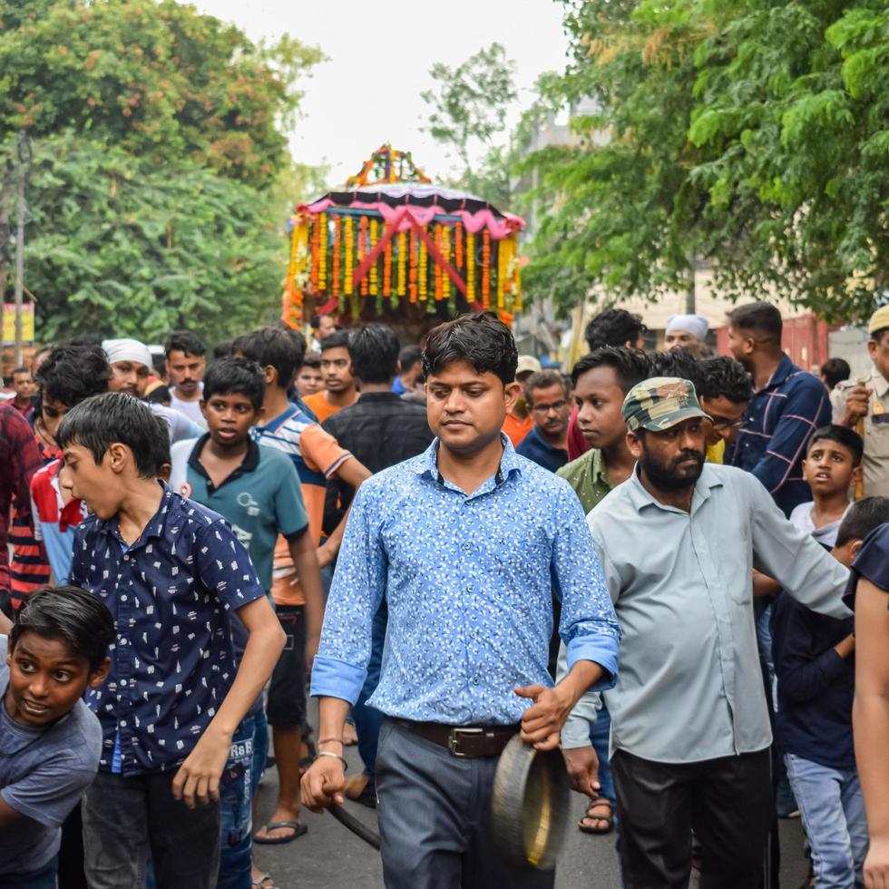 New Delhi, India July 01 2022 - A huge gathering of devotees from different parts of Delhi on the occasion of ratha yatra or rathyatra. Rath for Lord Jagannath pulled by people, Jagannath Rath Yatra photo