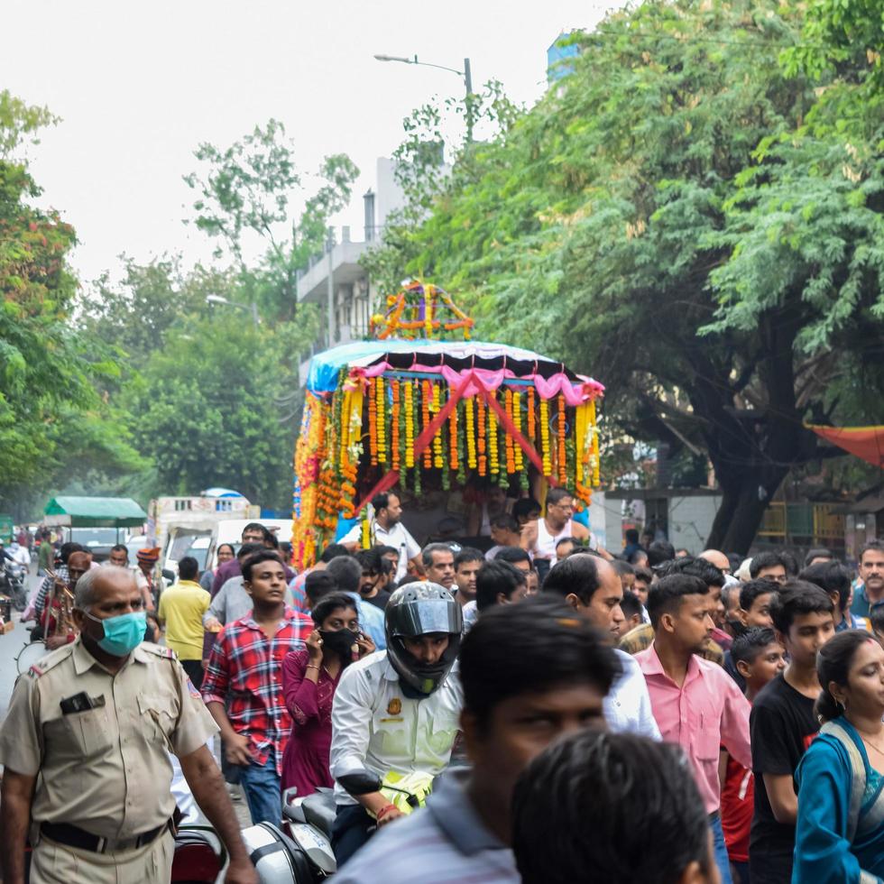 New Delhi, India July 01 2022 - A huge gathering of devotees from different parts of Delhi on the occasion of ratha yatra or rathyatra. Rath for Lord Jagannath pulled by people, Jagannath Rath Yatra photo