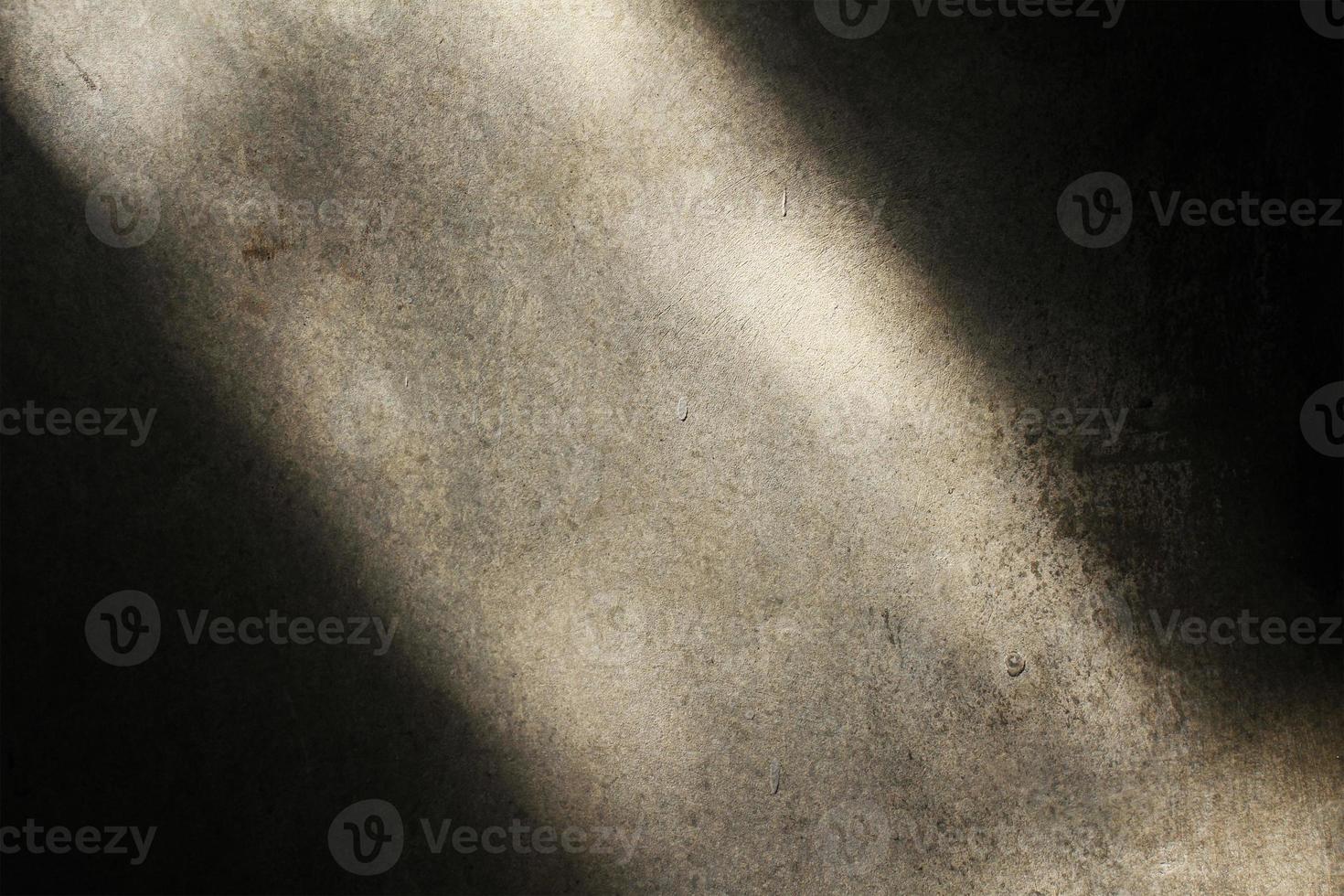 old cement wall texture background exposed to light photo