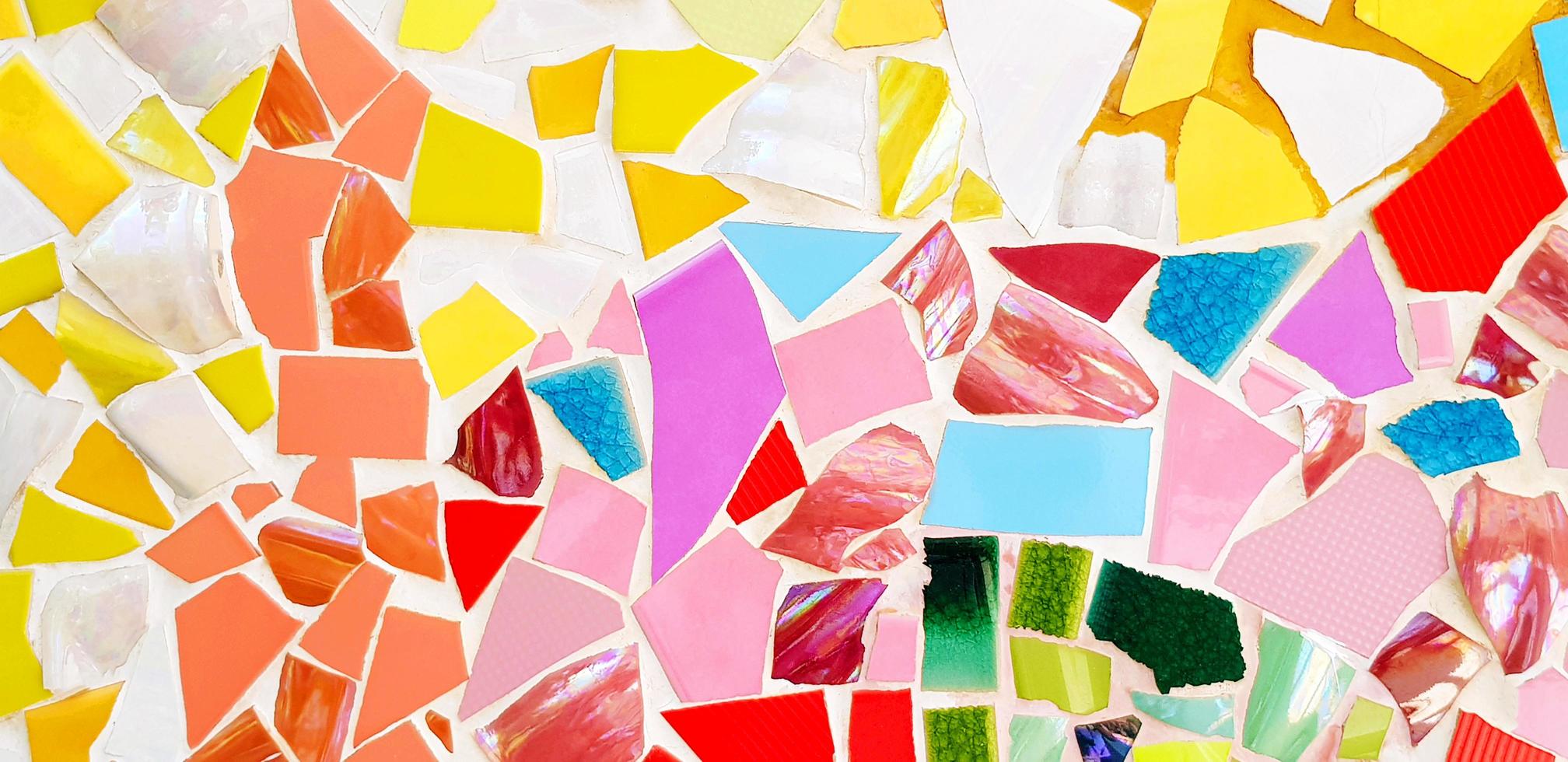 Colorful of mosaic tile floor for background. Art design wallpaper, Cracked, Shape and Abstract. Green, yellow, brown, red, blue, pink, white and orange tile fragments on wall. photo