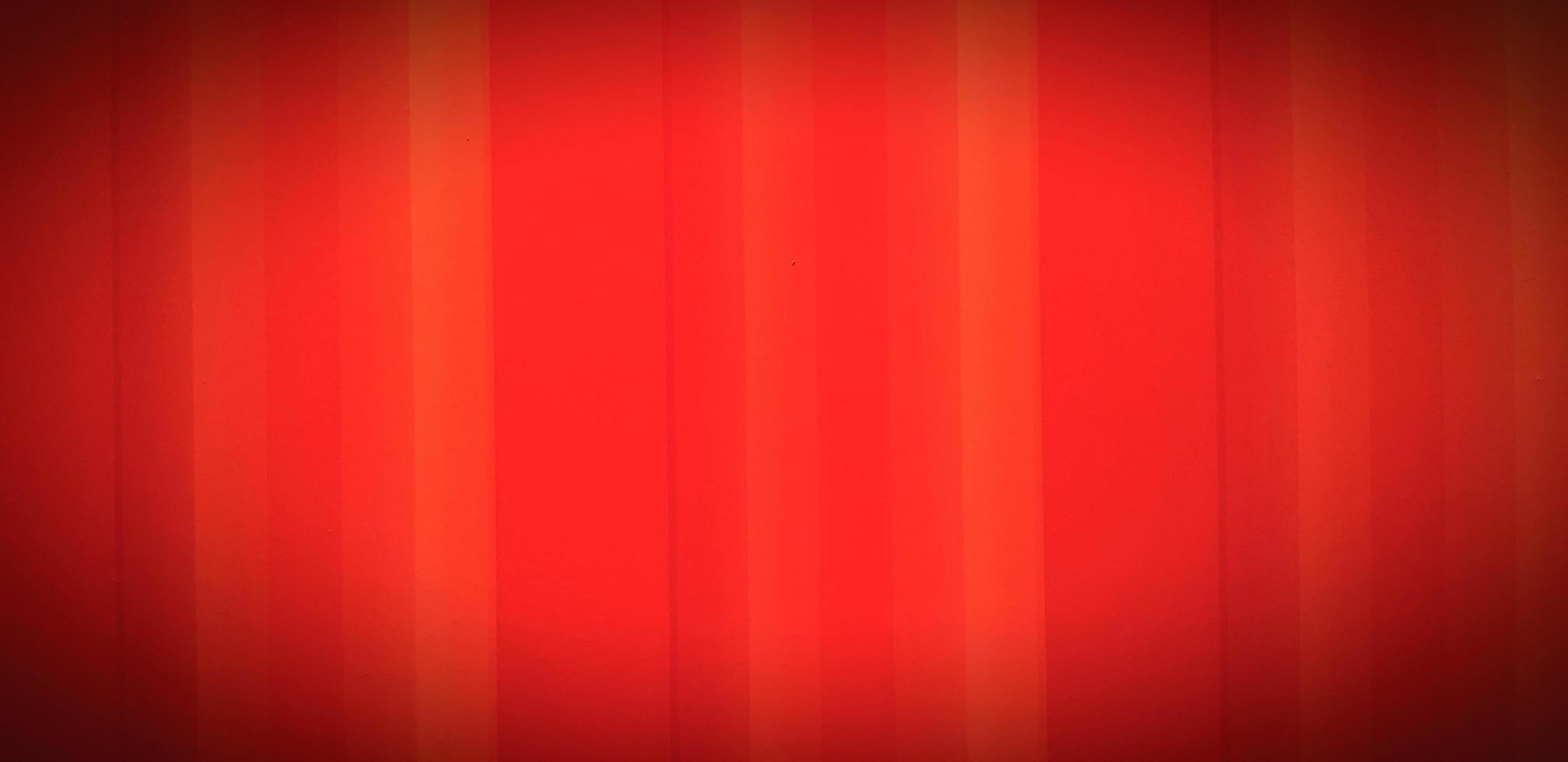 Line pattern of an orange background. Red wallpaper or wall with vignette style. photo