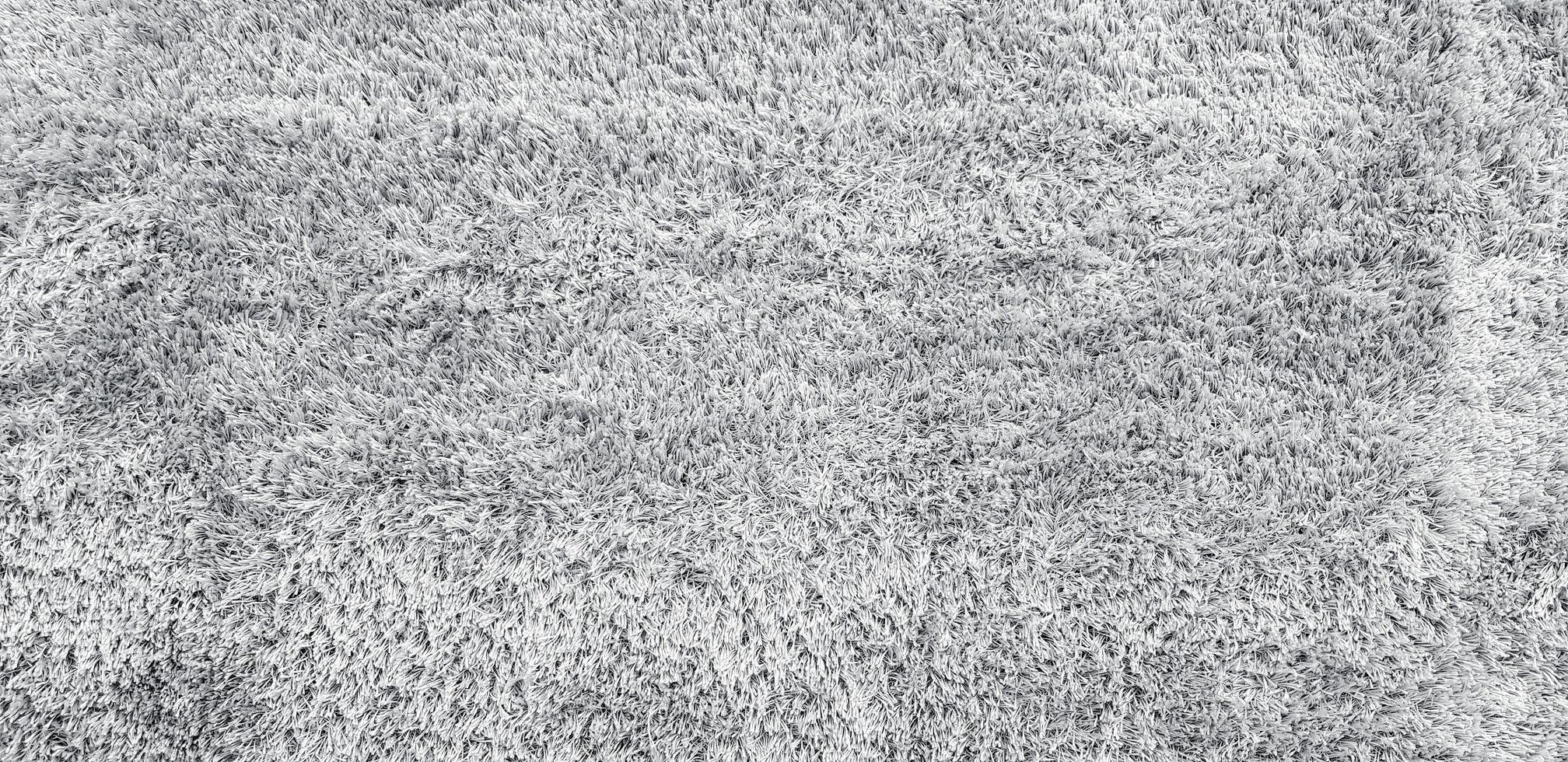 textura de alfombra o alfombra de lana gris o gris para fondo o papel tapiz. material suave y concepto de detalle foto