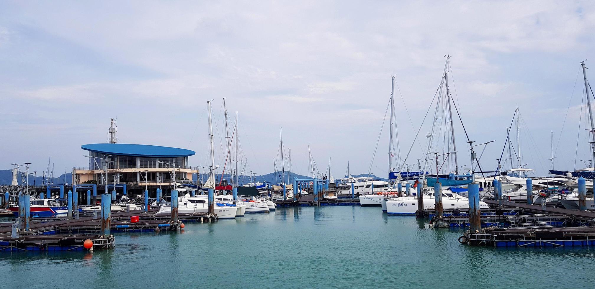 Phuket, Thailand - March 1, 2022 Many speed boats on sea at port or harbor. Vehicle on ocean with blue sky and white cloud background with copy space on top or above. Travel and Trip photo
