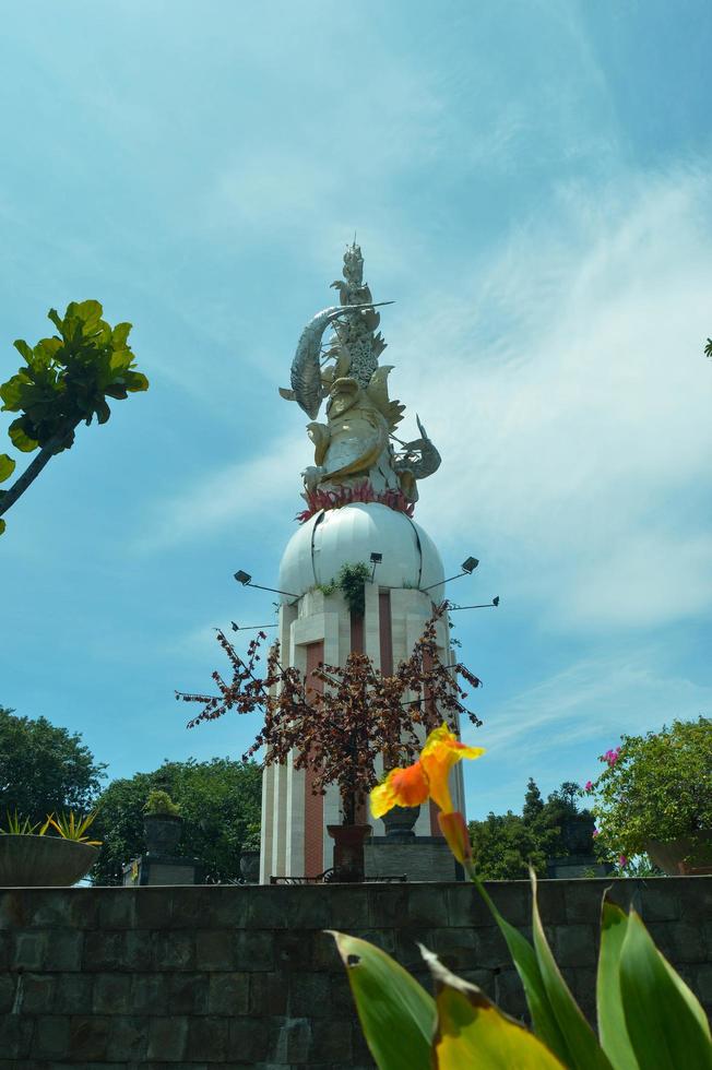 Sidoarjo, March, 2022 - view of the Sidoarjo city park with a monument when the weather is clear photo