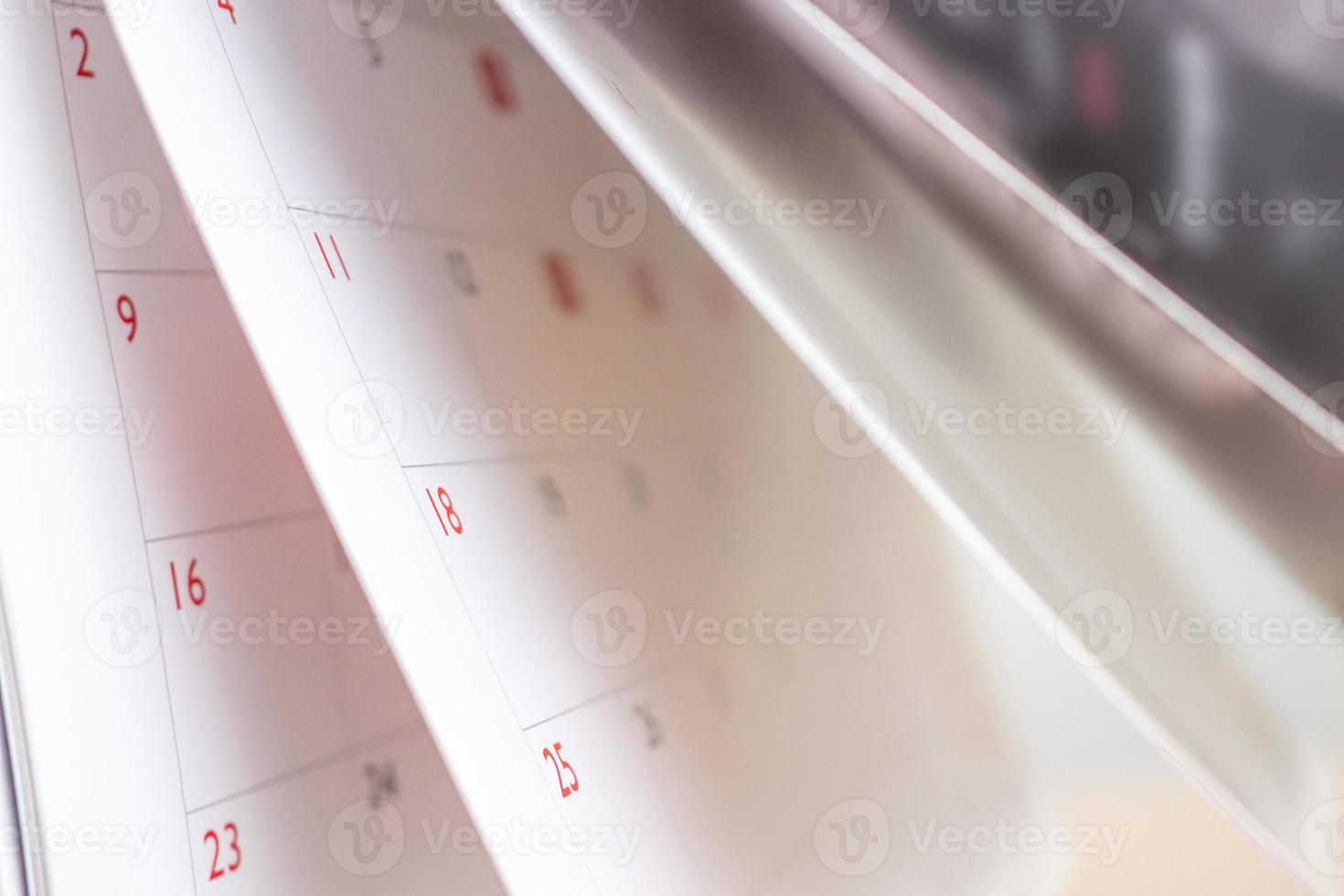Calendar page flipping sheet close up blur background business schedule planning appointment meeting concept photo