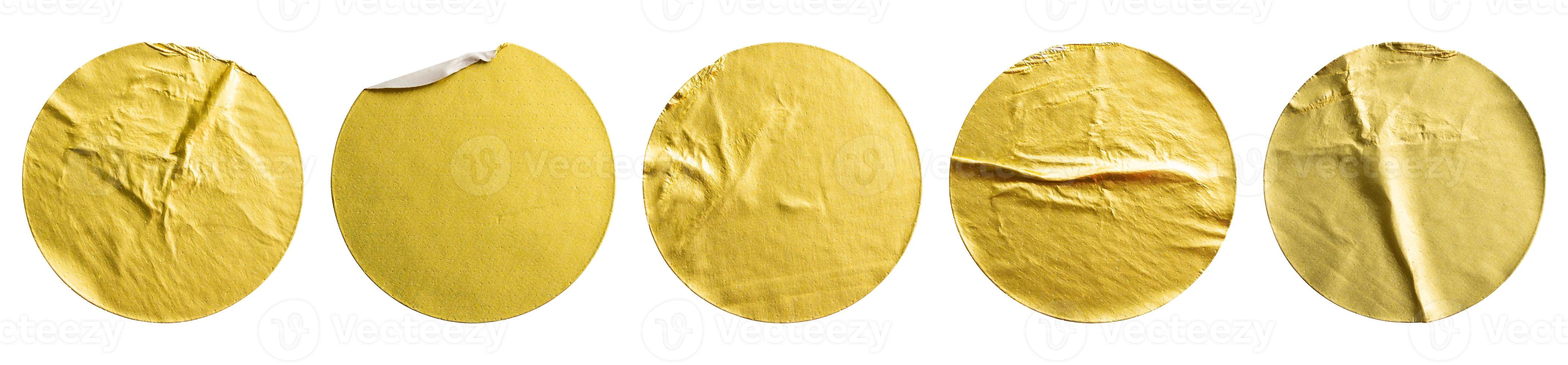 Blank golden round adhesive paper metallic sticker label set isolated on white background photo
