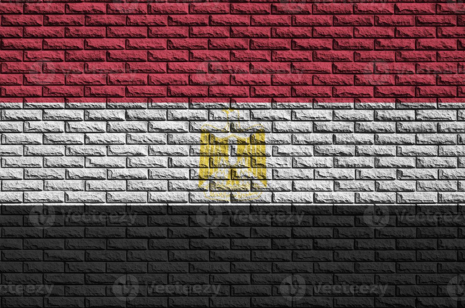 Egypt flag is painted onto an old brick wall photo