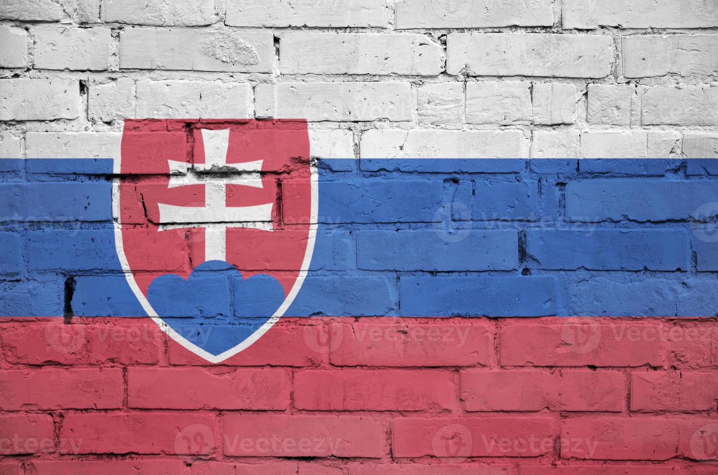 Slovakia flag is painted onto an old brick wall photo