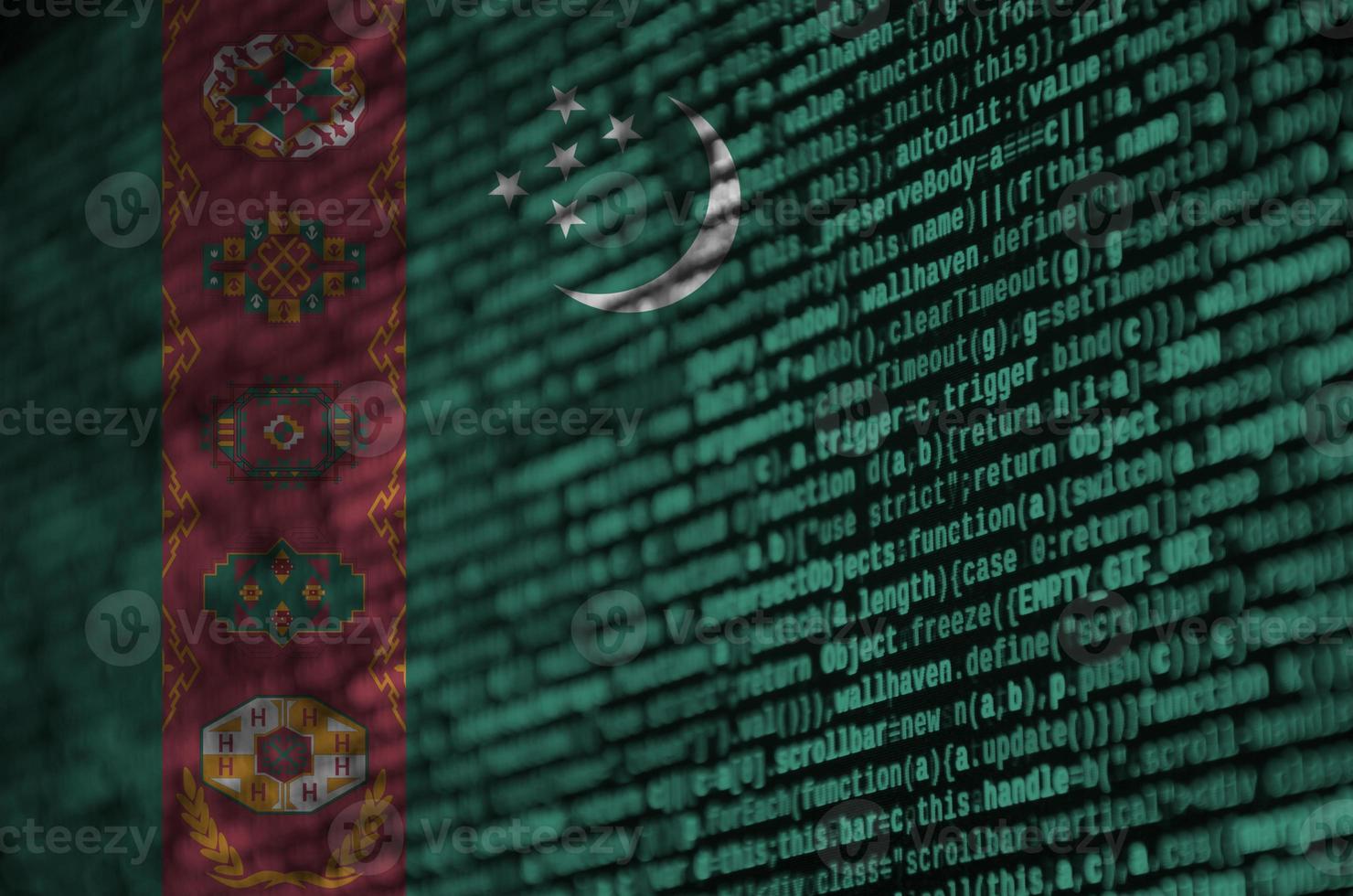 Turkmenistan flag  is depicted on the screen with the program code. The concept of modern technology and site development photo