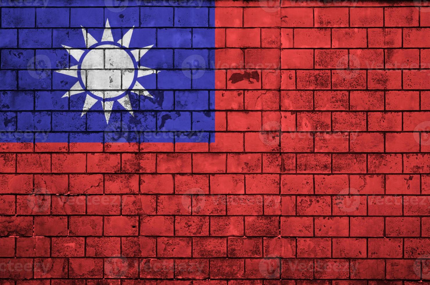 Taiwan flag is painted onto an old brick wall photo