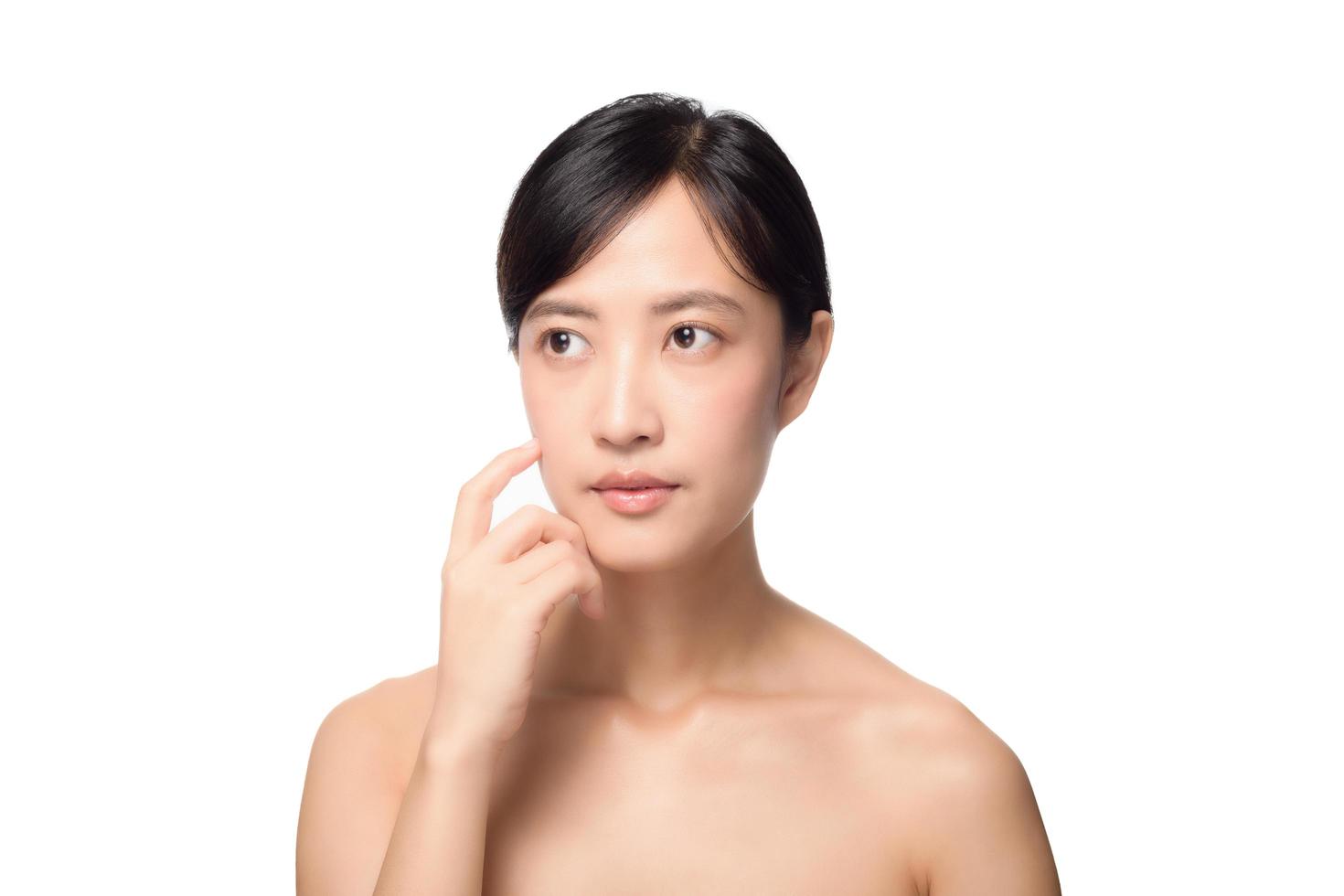 Portrait of beautiful young asian woman clean fresh bare skin concept. Asian girl beauty face skincare and health wellness, Facial treatment, Perfect skin, Natural make up on white background photo