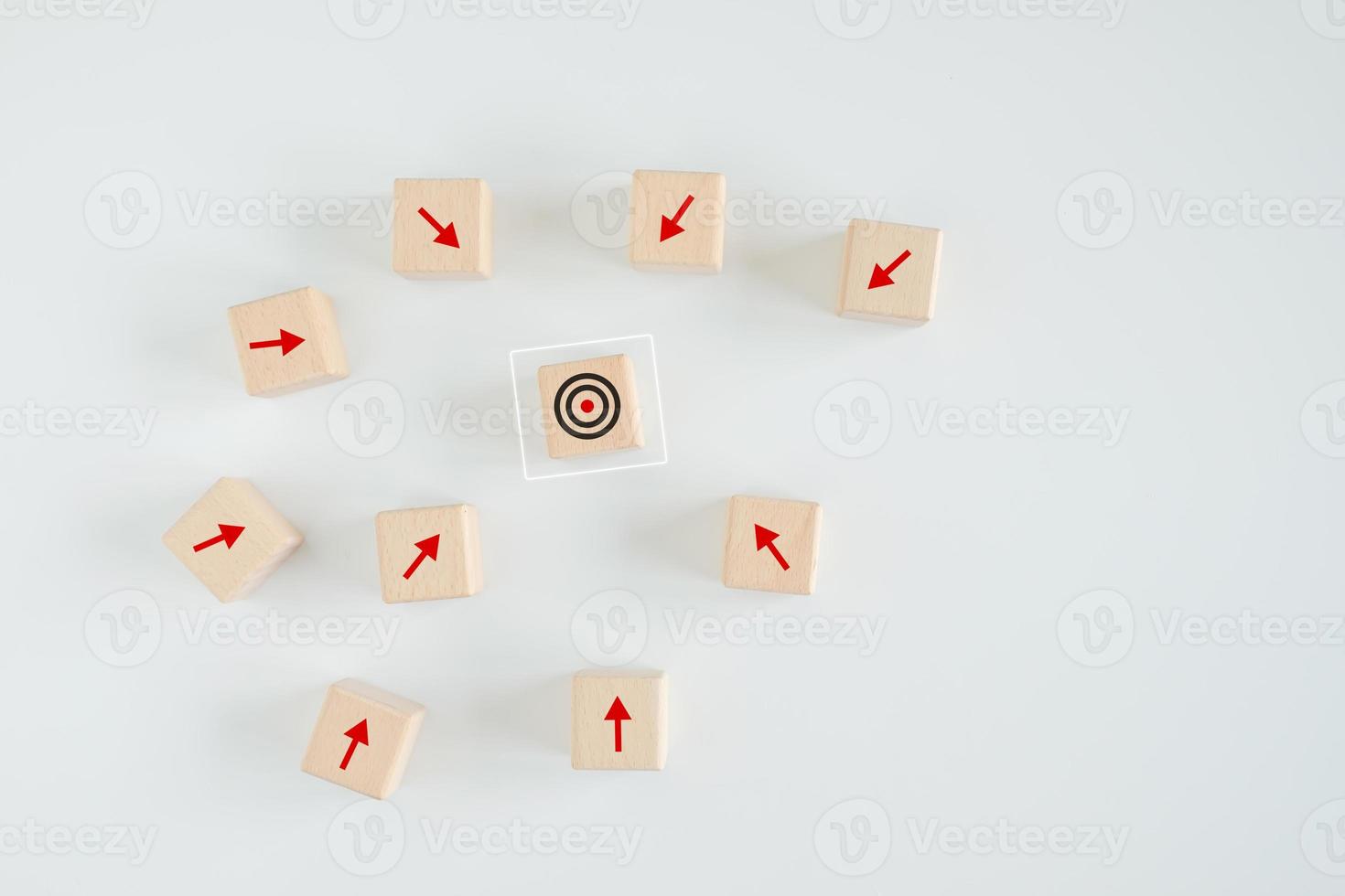 Business achievement goal and objective target. Growing business success concept. Wooden block with dart board on center and many arrow pointing to the target. photo