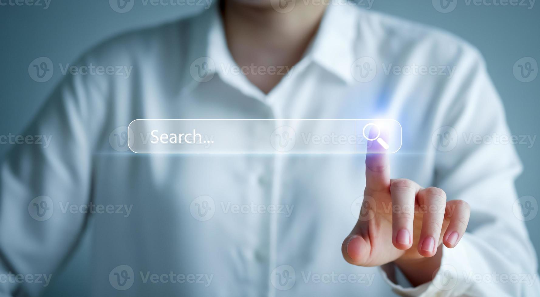 Data Search Technology Search Engine Optimization SEO. Woman's hands are touch on virtual search bar for surfing the internet and Searching for information on web browser. photo
