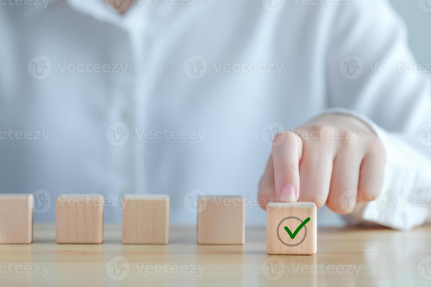 Individuality, Unique, Unswerving, Steady. Green correct check mark among many red wrong or cross icon on wooden circle for true or false changing mindset. Not changing or becoming weaker. photo