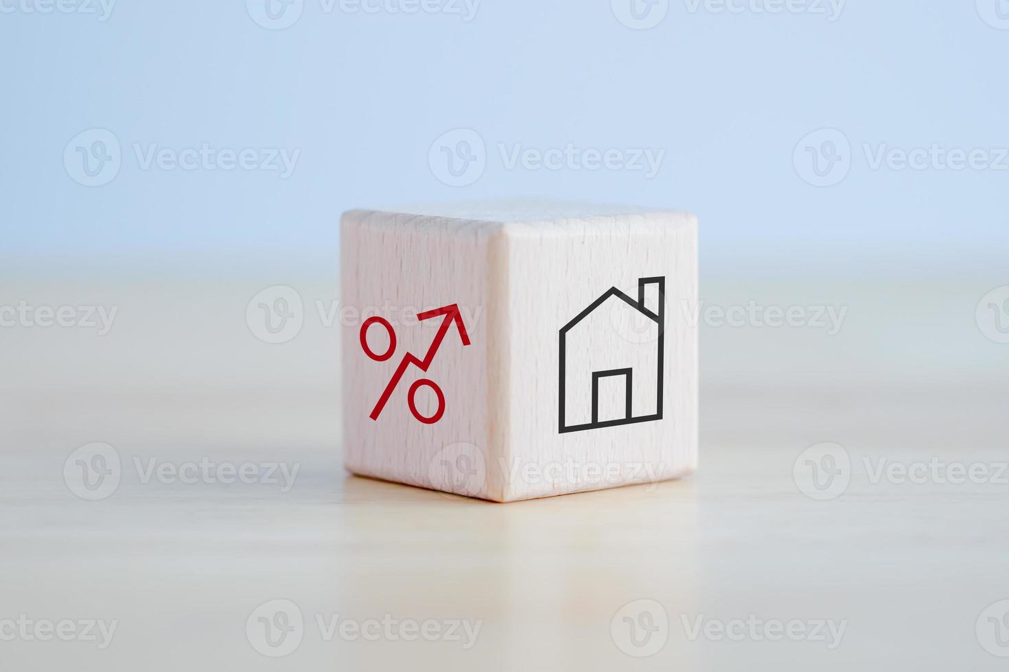 House and property investment and asset management concept. Loan, Mortgage, Inflation, Sale and tax rise. House icon and percentage sign on wooden block. Home price or increase of interest rate. photo