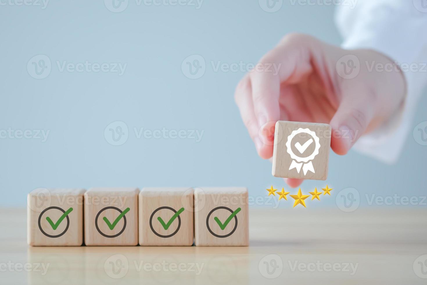 Businessman hand holding sign of the top service Quality assurance with 5 star, Guarantee, Standards, ISO certification, standardization concept, advertising product and service quality commitment. photo