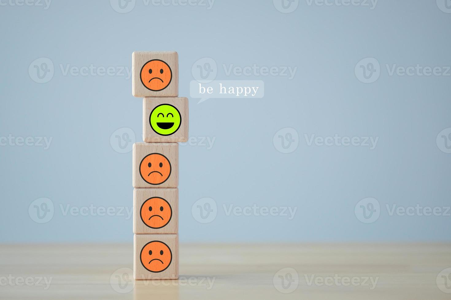 Happy face is among unhappy faces. Positive emotion. Mental health assessment. Satisfaction and service review. Feedback or Customer experience, World mental health day, Think positive. photo