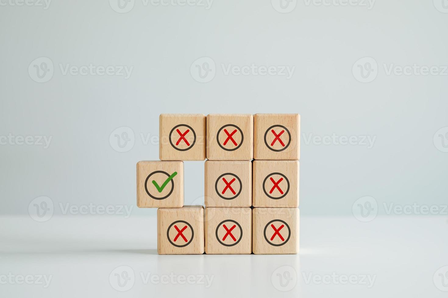 Individuality, Unique, Unswerving, Steady. Green correct check mark among many red wrong or cross icon on wooden circle for true or false changing mindset. Not changing or becoming weaker. photo