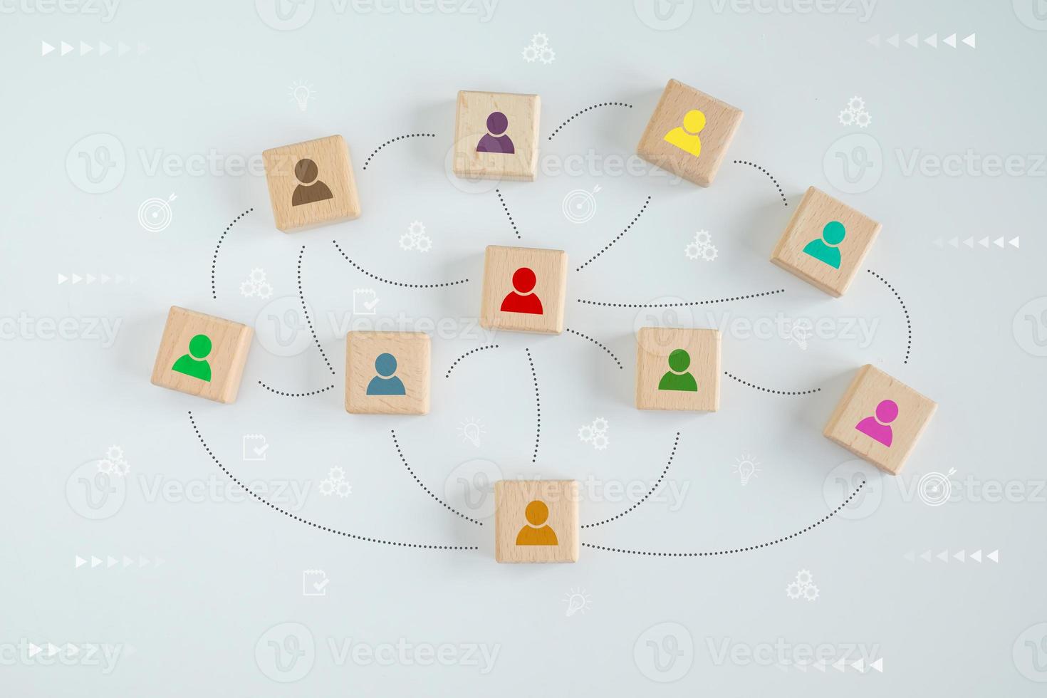 Many human icon on wooden blocks with line connection symbol for spread influence to people through a communication network. Social connections. Coordination. Teamwork. Building a strong team. photo