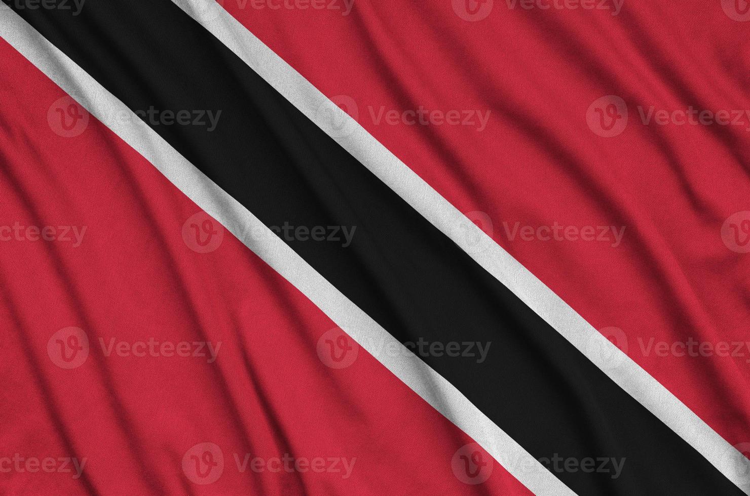 Trinidad and Tobago flag  is depicted on a sports cloth fabric with many folds. Sport team banner photo