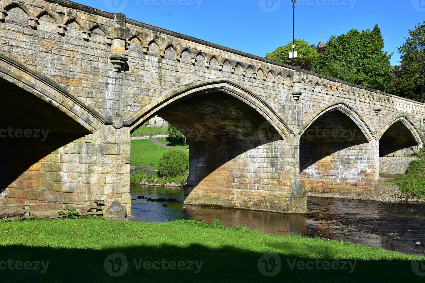 View of an Old Stone Bridge with Multiple Arches photo