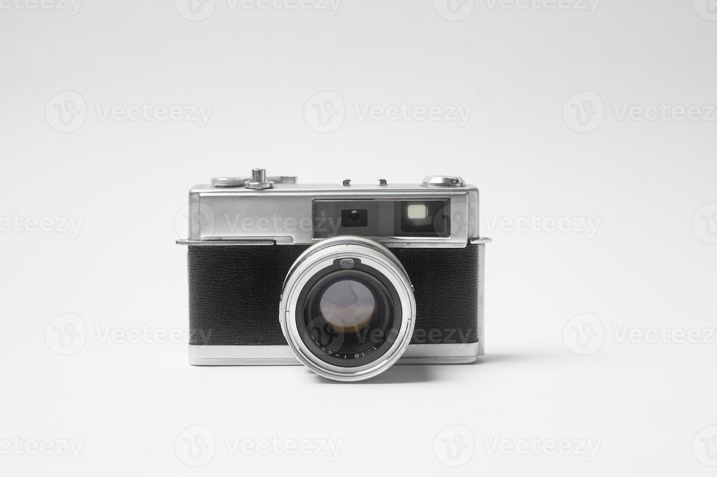 Vintage film camera over white background photo