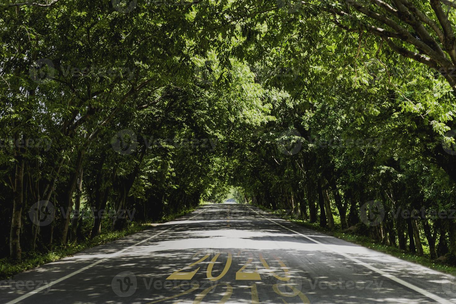 The word 2020 is written on the middle highway road, empty asphalt road, the concept for the new year 2020,motion blur. photo