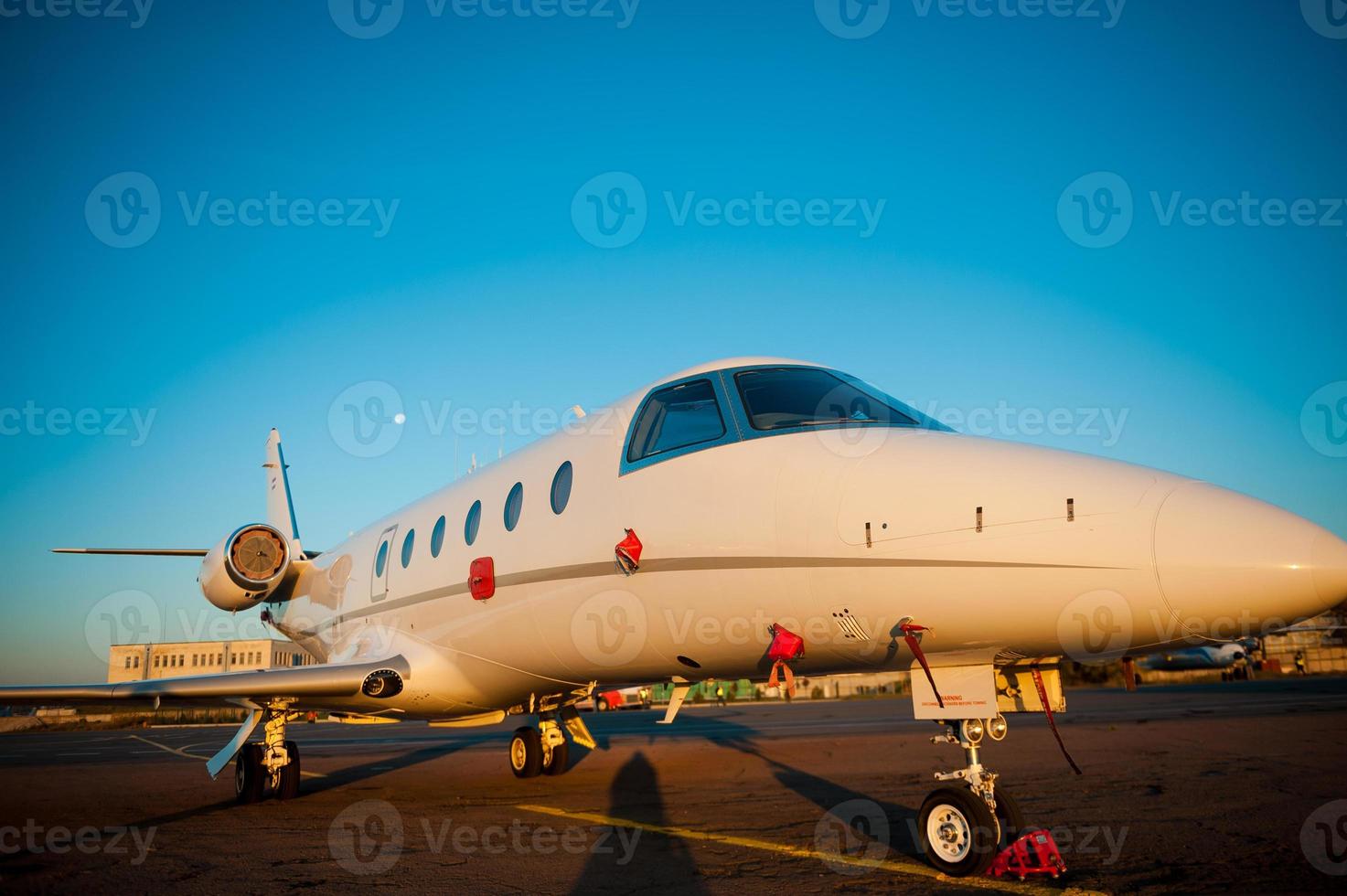 Corporate jet. Close-up of jet airplane is landing in airport photo