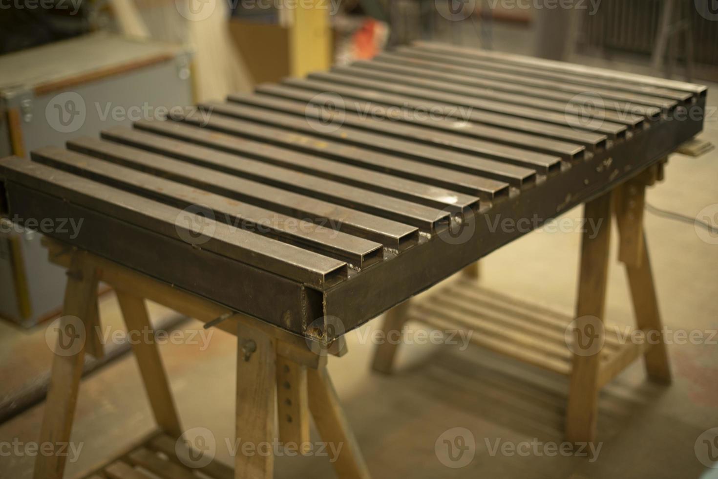 Steel table. Industrial processing. Details of work with structure. photo