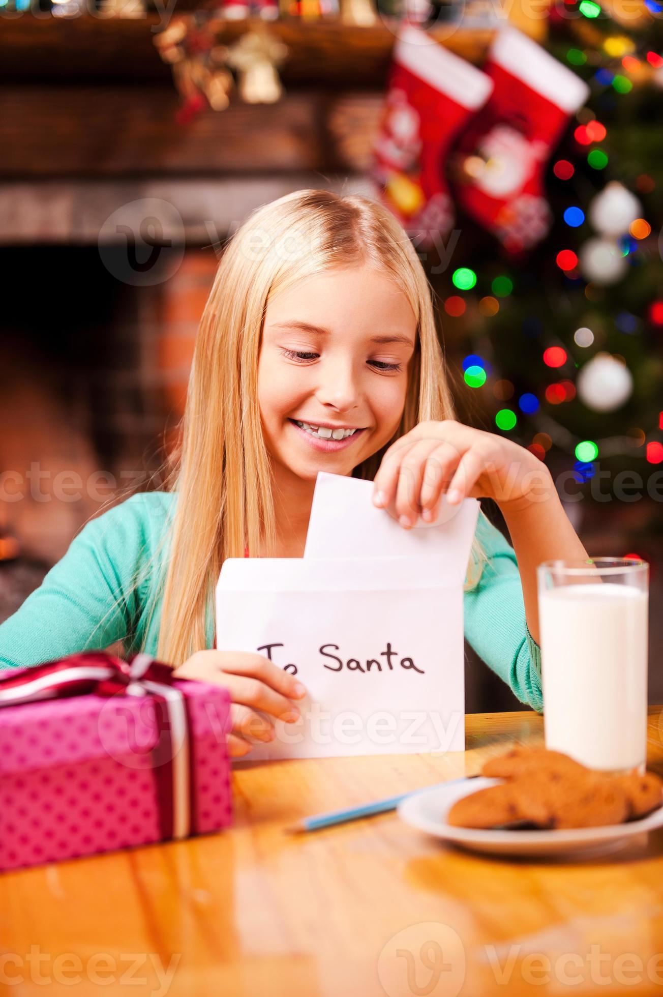 letter-to-santa-cute-little-girl-putting-a-letter-to-santa-into-the