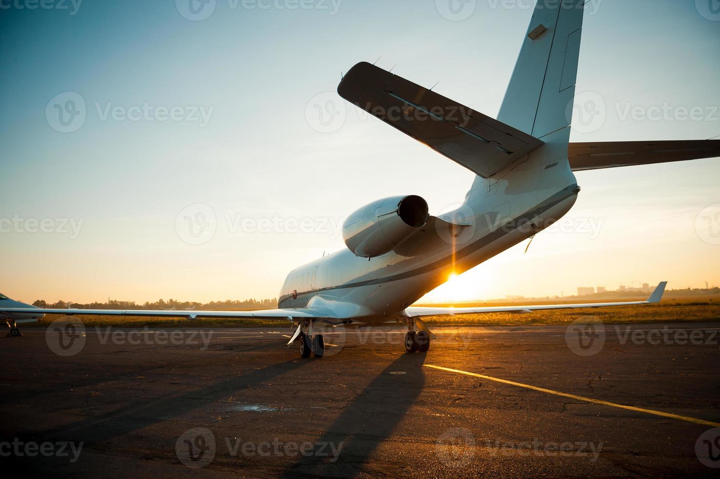 Ready to take off. Rear view of airplane taking off from airport photo