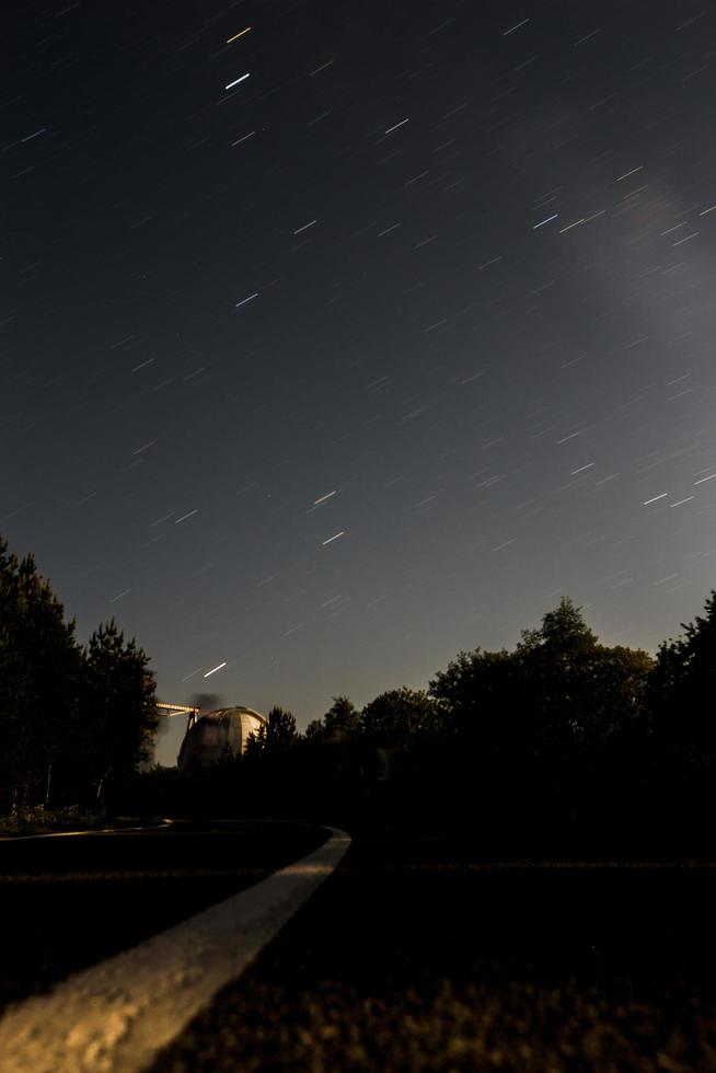 Night starry sky in mountains photo