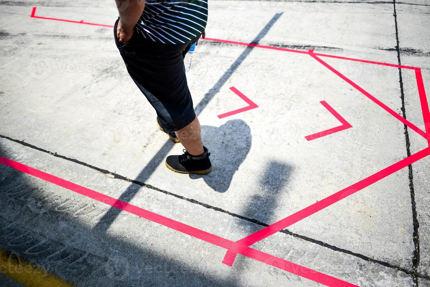 Low angle view of a mechanic standing on the pit lane photo