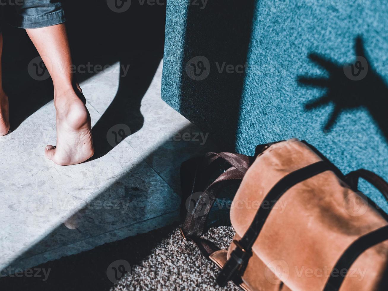 Shadow of a hand to grap the bag as soon as the owner walk away photo
