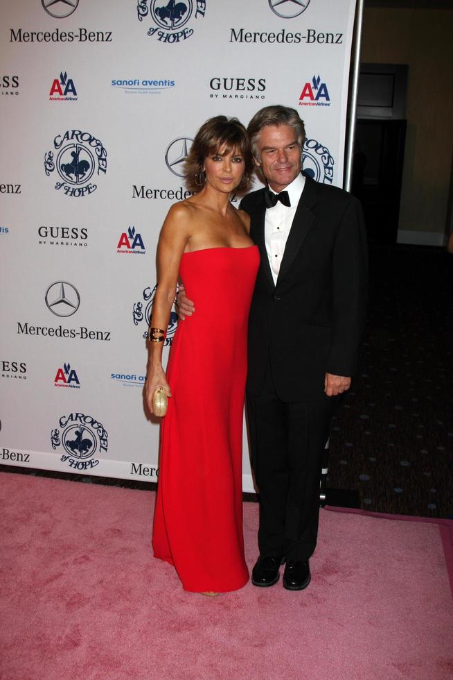 LOS ANGELES, OCT 23 - Lisa Rinna, Harry Hamlin arrives at the 2010 Carousel of Hope Ball at Beverly HIlton Hotel on October 23, 2010 in Beverly Hills, CA photo