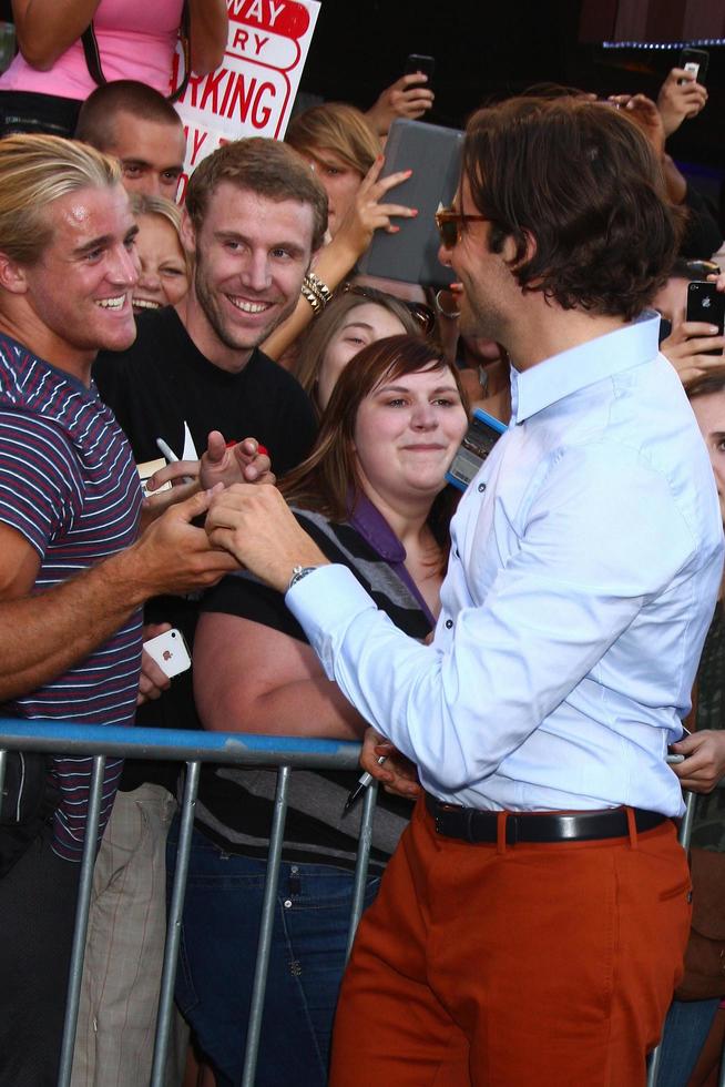 LOS ANGELES, MAY 16 - Bradley Cooper interacts with fans at the Hangover III LA premiere at the Village Theater on May 16, 2013 in Westwood, CA photo