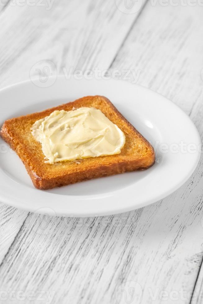 Toast with butter 13305732 Stock Photo at Vecteezy