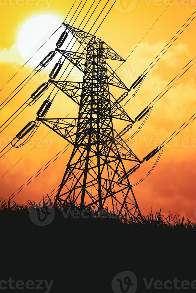 Silhouettes of high voltage poles and power lines It has a complex steel structure, it is strong and durable. photo