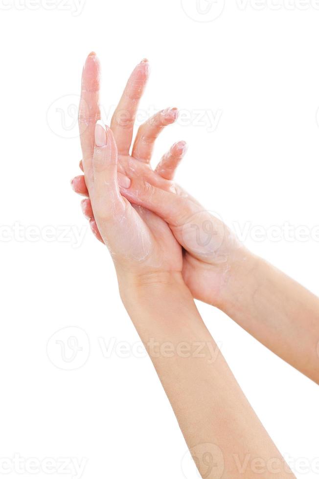 Massaging hand. Close-up of beautiful female hands isolated on white photo