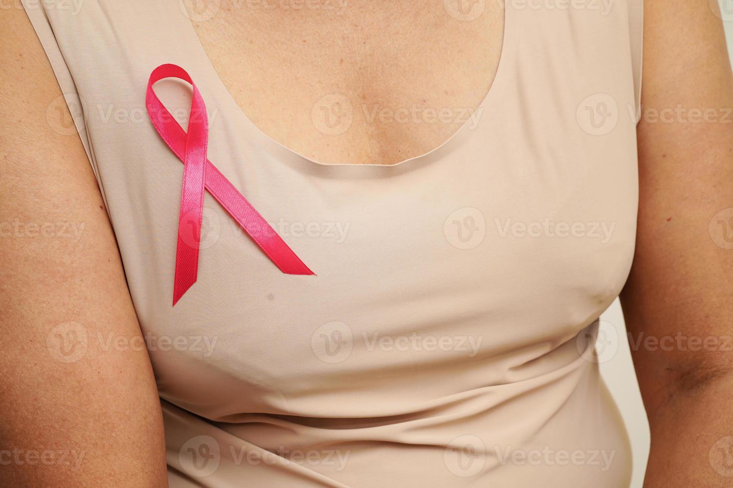 Asian woman with pink ribbon, World Breast Cancer Day at October. photo