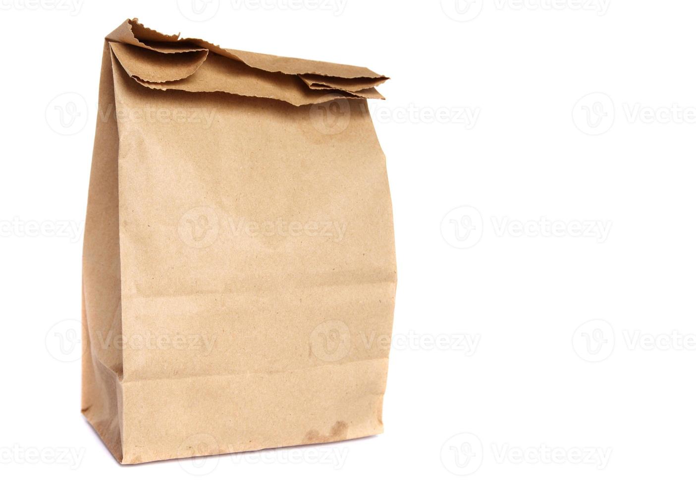 Brown paper bag isolated on white photo
