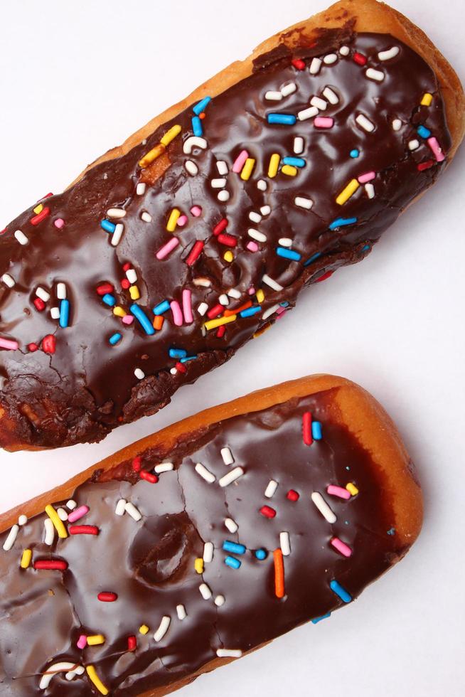 Chocolate donut bar topped with multicolored sugar flakes. laid on a white background 13310456